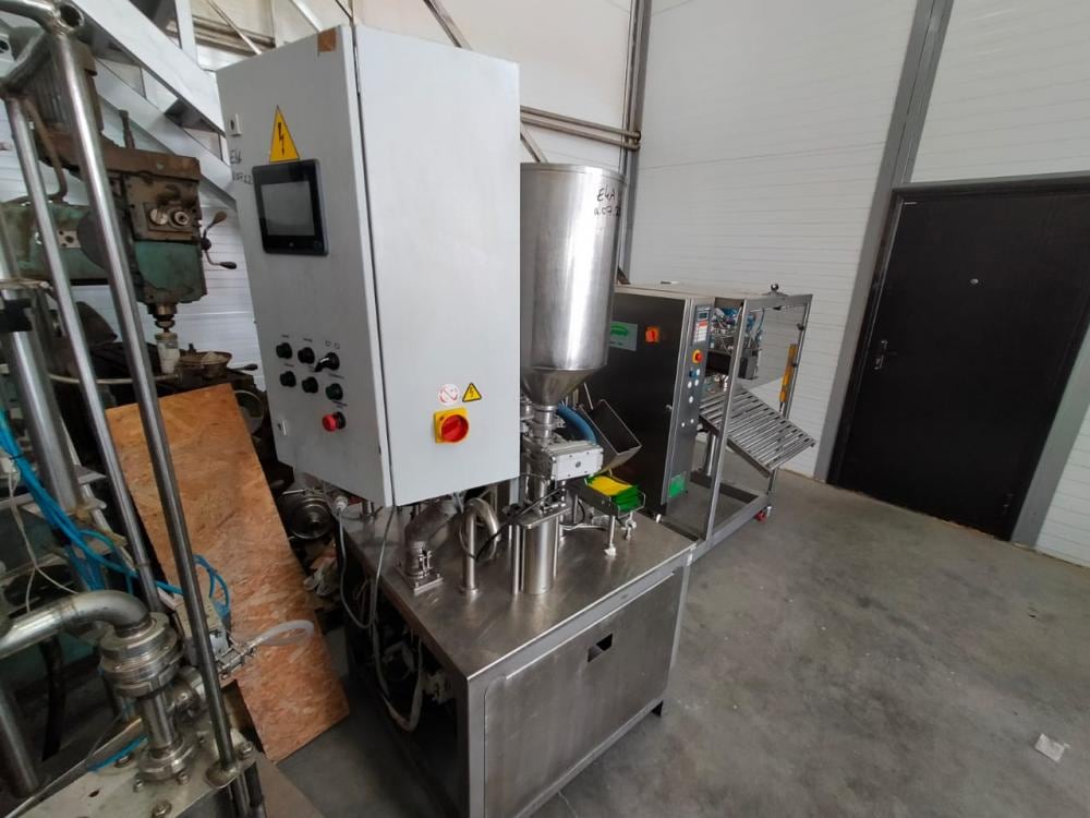 Фасовщик  жидких и густых продуктов в пакеты Дойпак е.2002