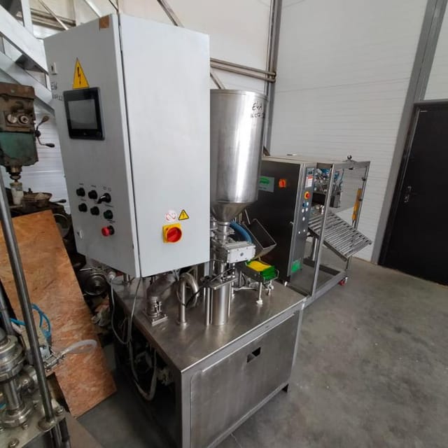 Фасовщик  жидких и густых продуктов в пакеты Дойпак е.2002