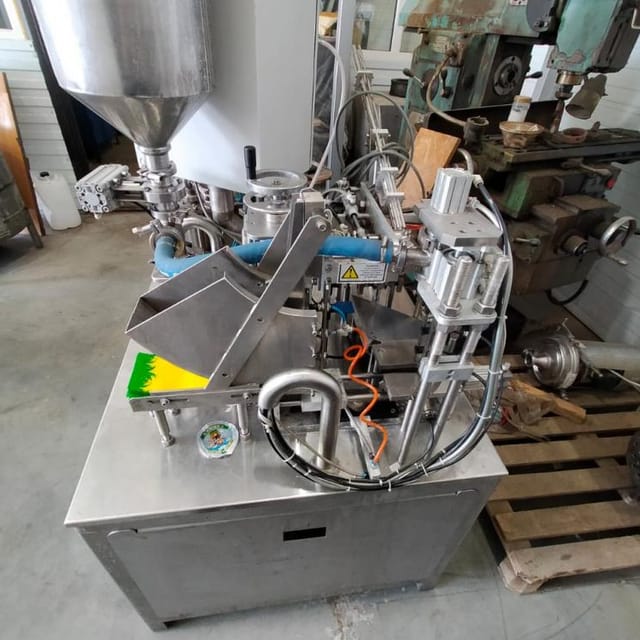 Фасовщик  жидких и густых продуктов в пакеты Дойпак е.2002