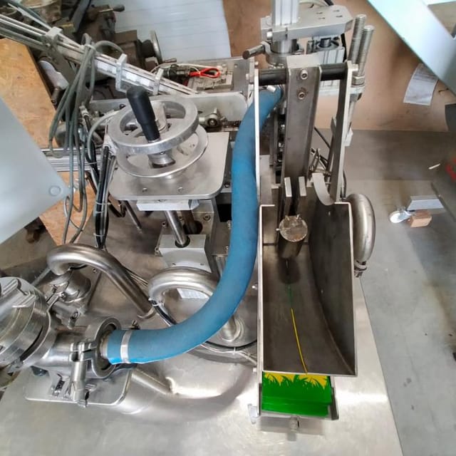 Фасовщик  жидких и густых продуктов в пакеты Дойпак е.2002